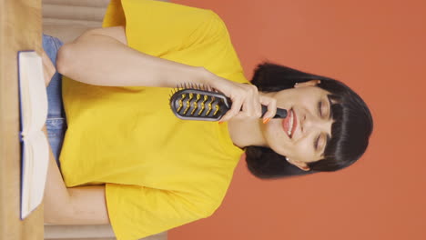 Vertical-video-of-The-young-woman-is-singing.